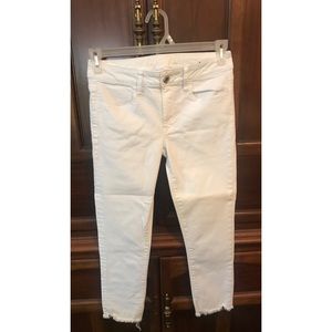 White frayed ankle skinnies